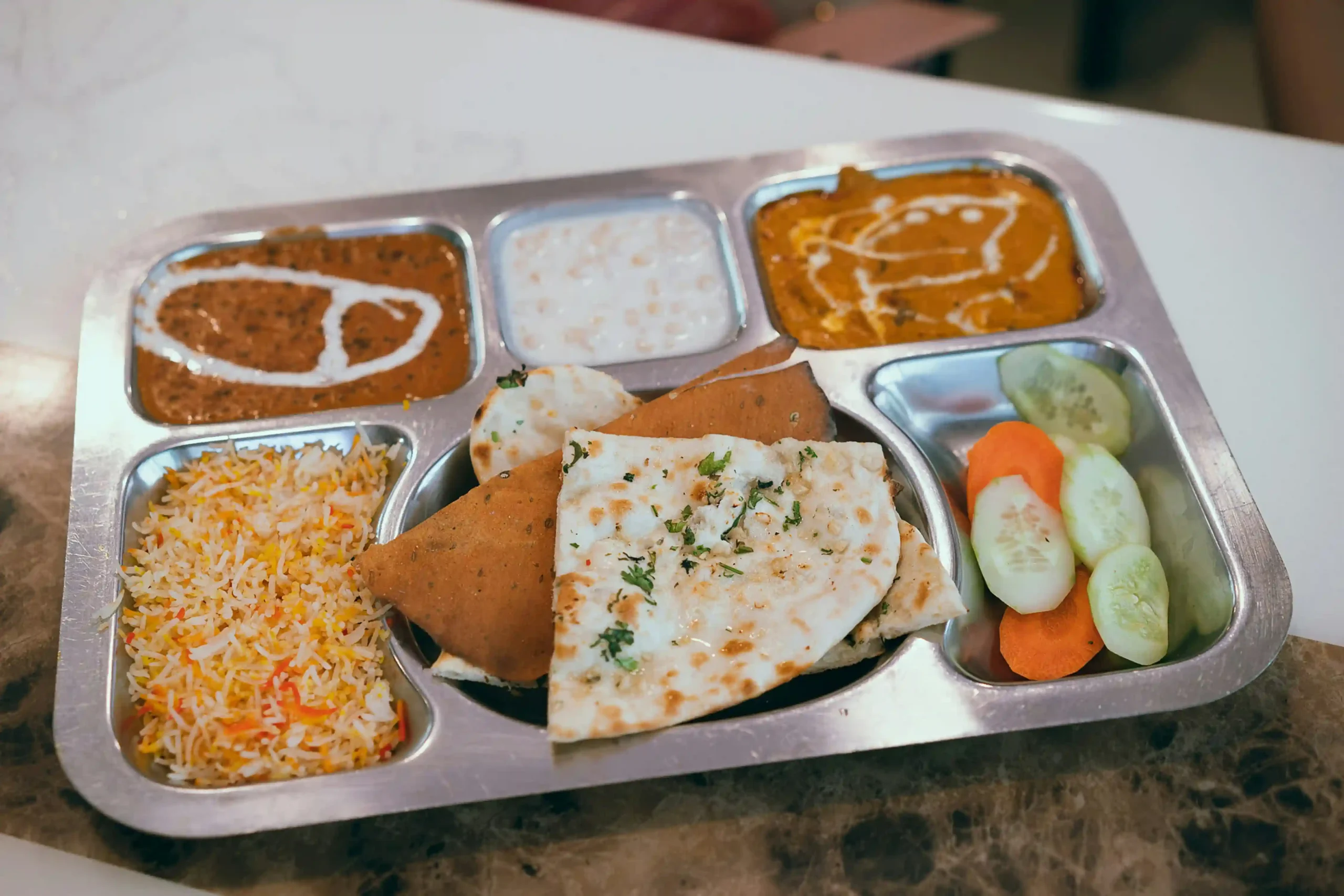 Authentic Nepali Thakali and Indian food in San Marcos Texas – Mustang Thakali Kitchen with rice, dal, vegetables, curries, and chutneys.