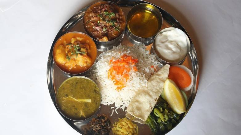 Nepali Thakali khana set with rice, dal, curry, and achar at Mustang Thakali Kitchen San Marcos TX